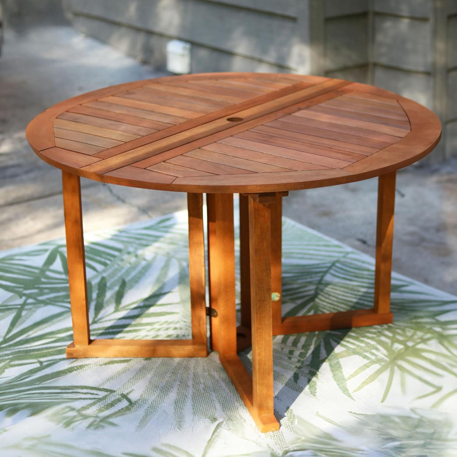 imageSunnydaze Malaysian Hardwood Folding Gateleg Patio Dining Table with Teak Oil Finish 4Person SpaceSaving Round Outdoor Table 4725 D x 29quot H